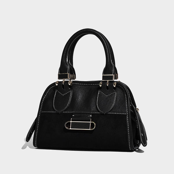 Kleine strukturierte Henkeltasche mit abgerundeten Henkeln, kontrastierenden weißen Ziernähten, silberfarbenem Stäbchenverschluss und abnehmbarem