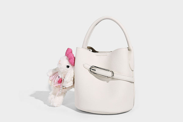 Mini pebbled leather-look bucket bag with front buckle strap, silver-tone hardware, top handle, and detachable shoulder