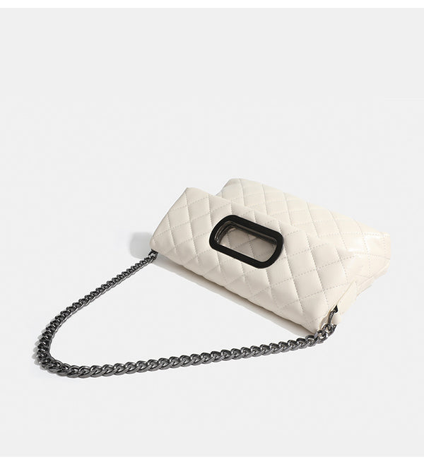 Quilted diamond-stitch flap crossbody bag with gunmetal chain strap and cut-out bar handle, detail view 14