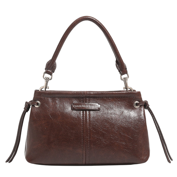 Compact retro mini shoulder bag with crinkled leather-look finish, drawstring side detail, and silver-tone hardware, detail