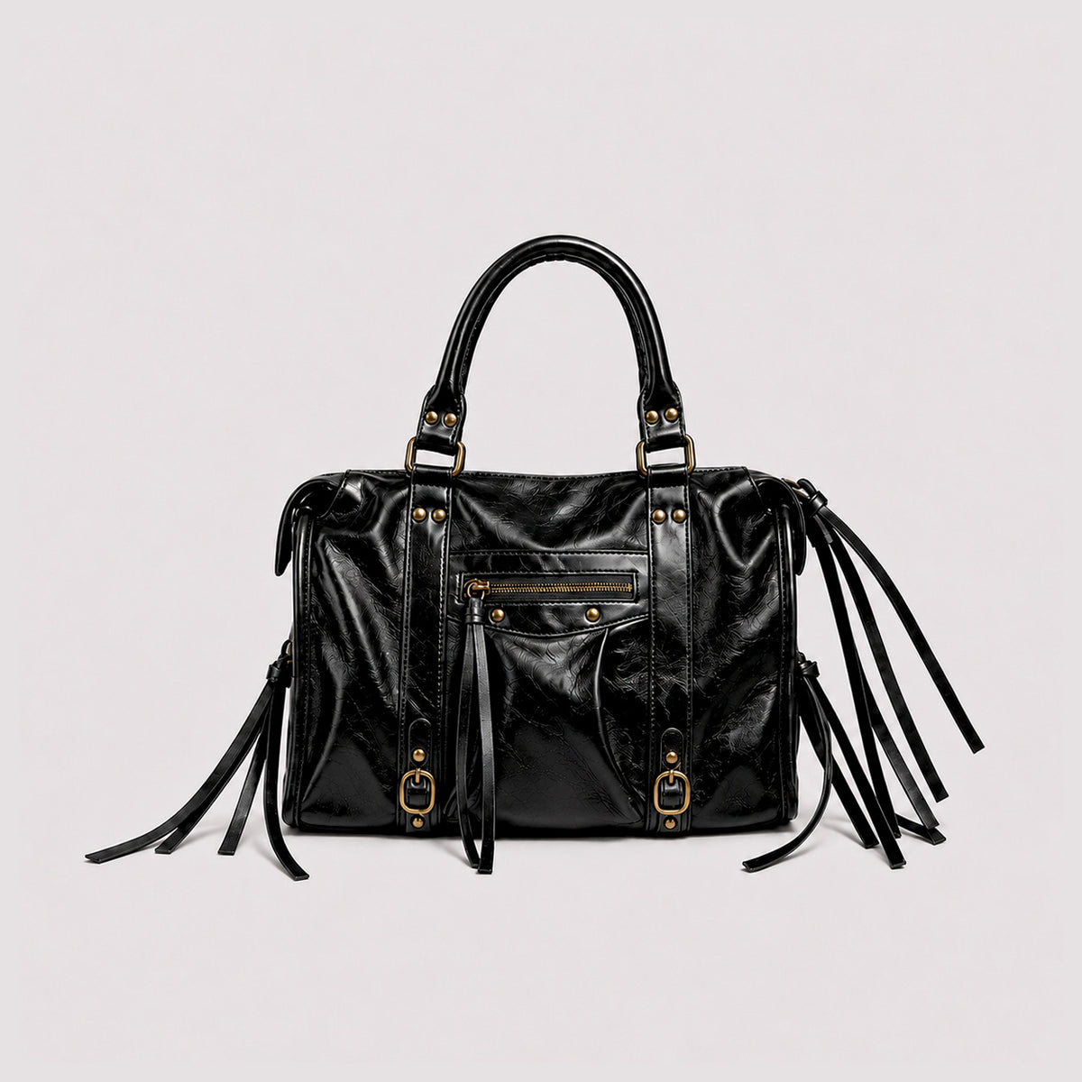Structured glossy leather-look satchel bag with brass-tone studs, side tassel fringe, dual top handles, and front zip pocket