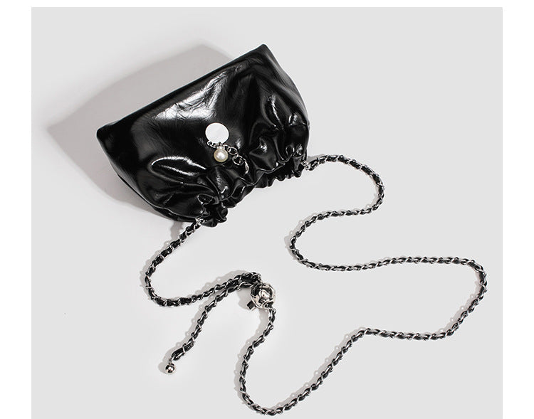 Small ruched drawstring bucket bag with twisted-link chain strap and pearl charm pull, detail view 15