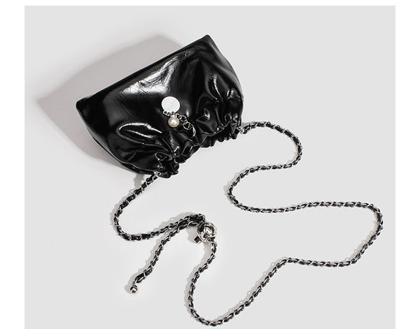 Small ruched drawstring bucket bag with twisted-link chain strap and pearl charm pull, detail view 15