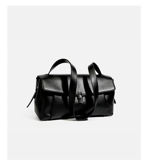 Structured rectangular flap shoulder bag with smooth leather-look finish, silver-tone turn-lock clasp, and long slim