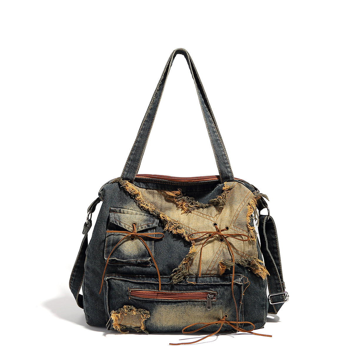 Large distressed denim patchwork shoulder tote bag with frayed panels, leather-look lace detailing, and front zip pocket in