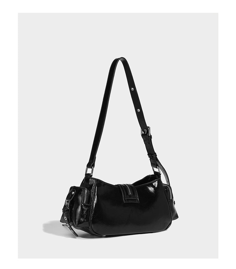 Compact glossy leather-look crossbody bag with silver studs, buckle hardware, and multiple zip pockets, detail view 11