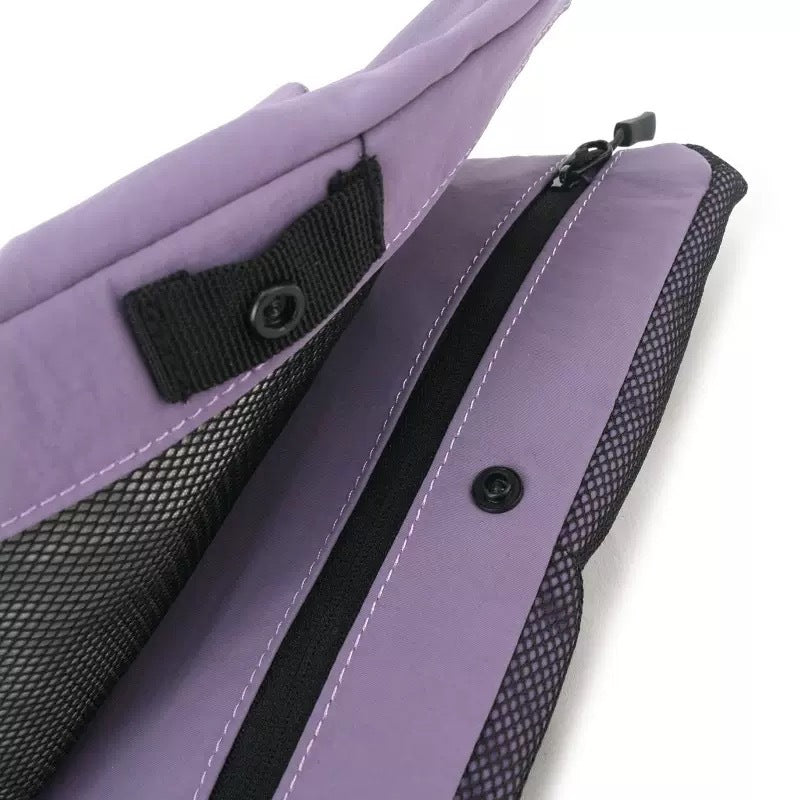 Flat rectangular crossbody bag with mesh front pocket, top zip closure, and adjustable patterned strap, detail view 13