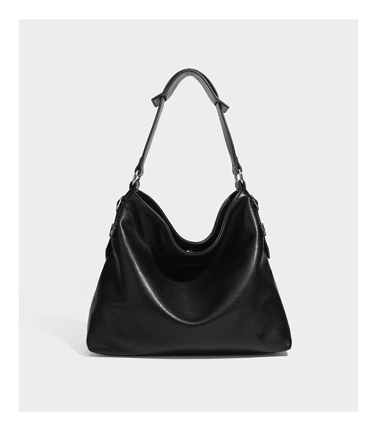 Large slouchy hobo shoulder bag in dark brown with smooth leather-look finish, adjustable strap, and silver-tone hardware
