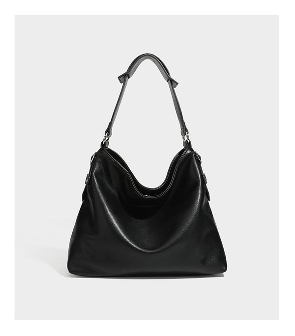 Large slouchy hobo shoulder bag in dark brown with smooth leather-look finish, adjustable strap, and silver-tone hardware