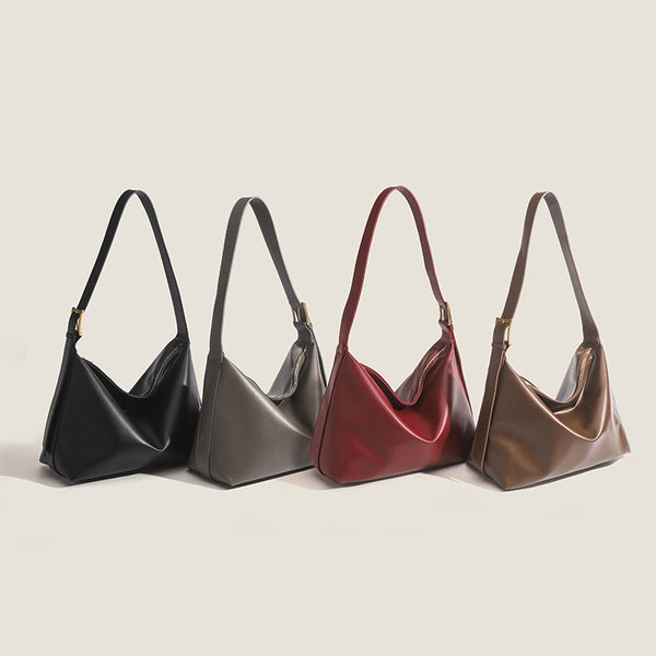Large slouchy hobo shoulder bag in smooth leather-look finish with single long strap and gold-tone zip closure, detail view 2