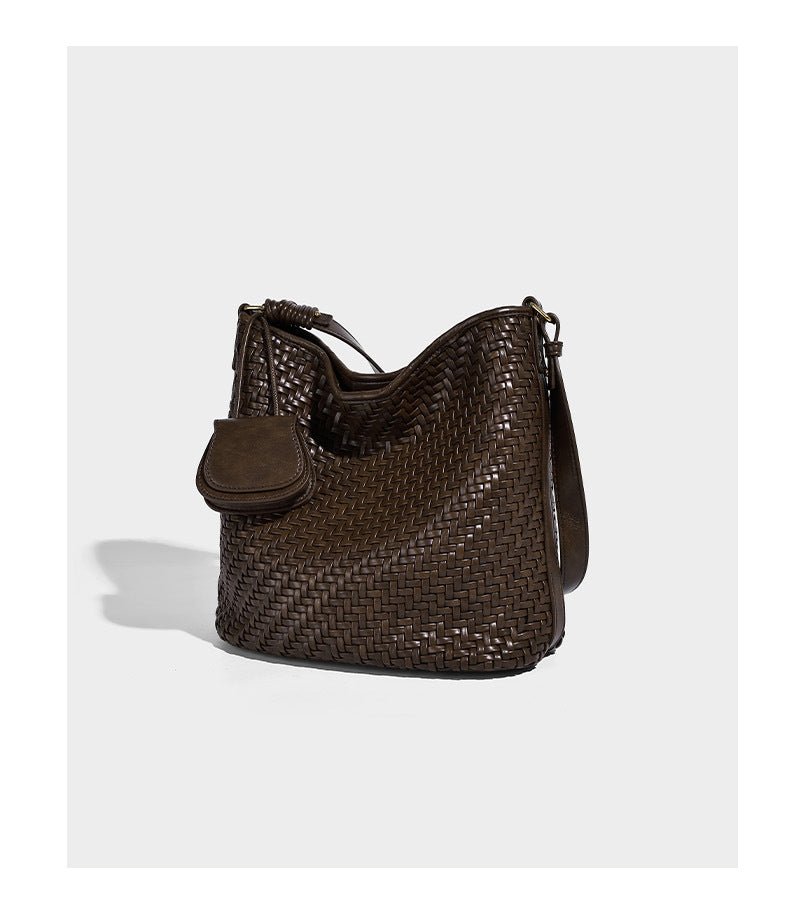 Woven leather-look bucket bag with basket-weave texture, attached mini pouch, and adjustable shoulder strap, detail view 12