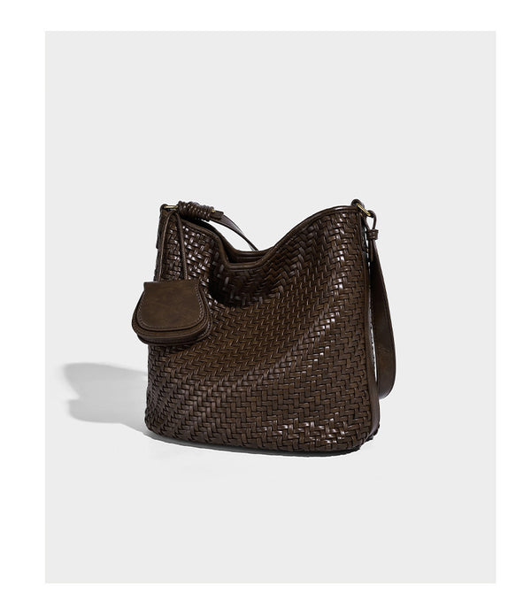Woven leather-look bucket bag with basket-weave texture, attached mini pouch, and adjustable shoulder strap, detail view 12
