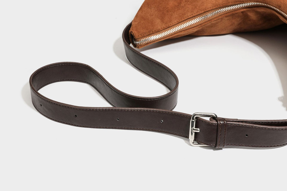 Slouchy cognac brown matte suede-look hobo shoulder bag with dark brown leather-look trim, top zip closure, front flap