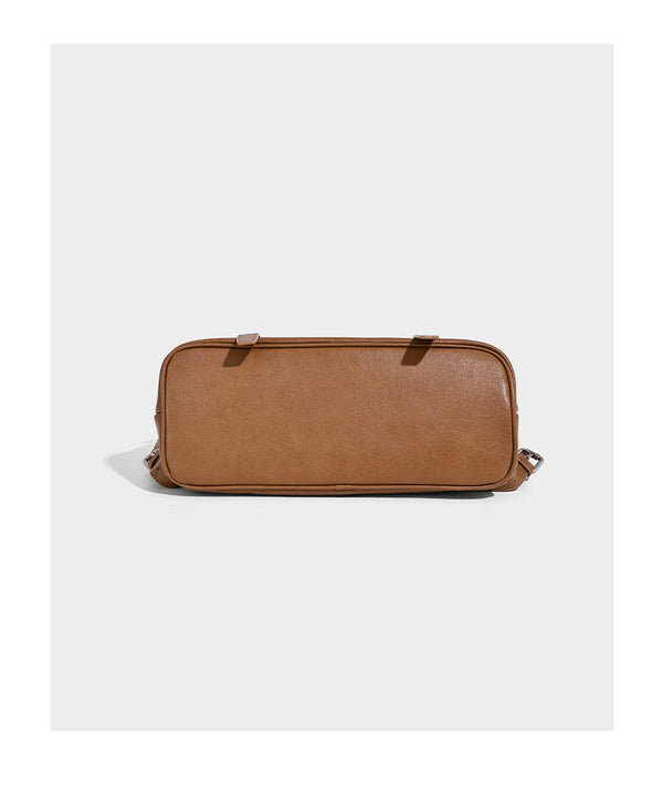 Structured tan leather-look flap backpack handbag with top handle, silver buckle hardware, and fold-over front closure