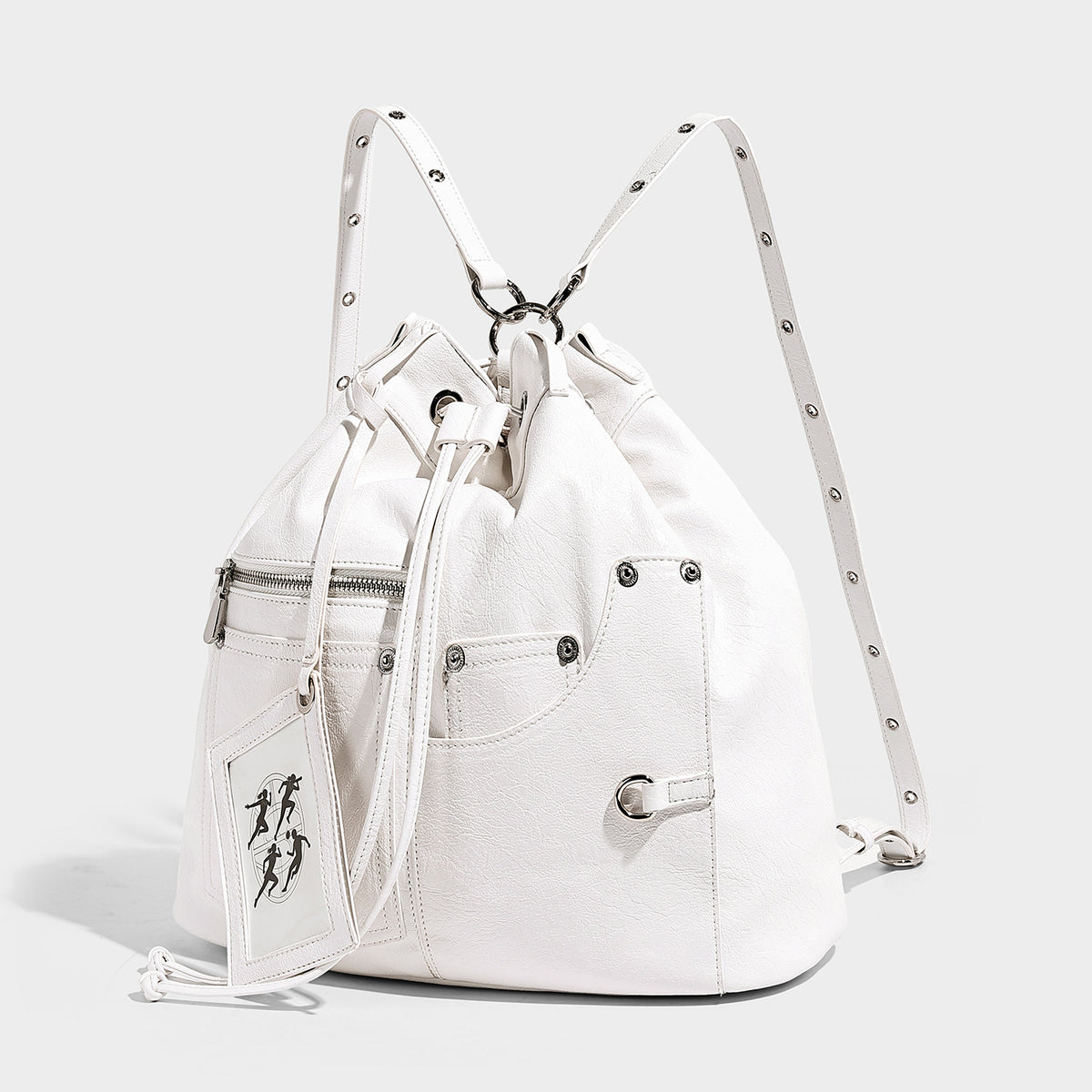 Glossy black convertible bucket backpack with silver grommet-studded straps, drawstring cinch closure, and front zip pocket