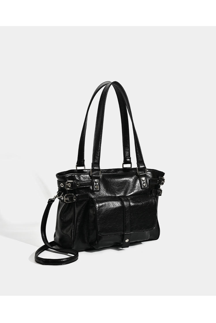 Large glossy leather-look tote bag with front flap pocket, silver-tone buckle hardware, dual top handles and detachable