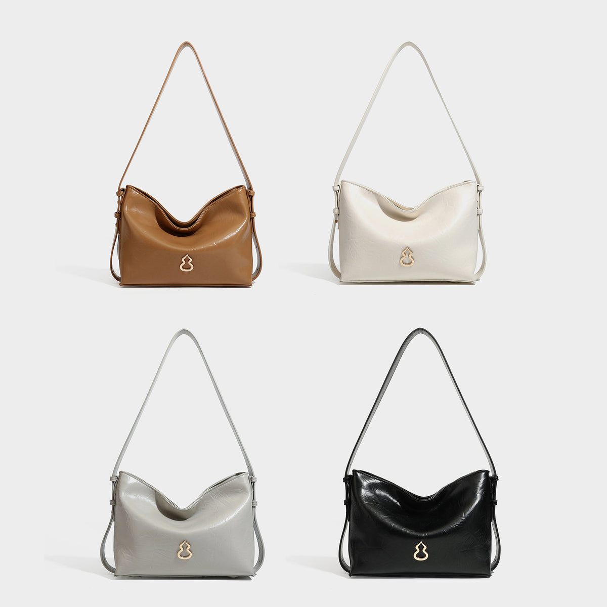 Lässig fallende Hobo-Schultertasche mit offenem Oberteil aus glänzender, karamellbrauner Lederoptik, mit Logo-Beschlägen in Goldoptik und langem, verstellbarem
