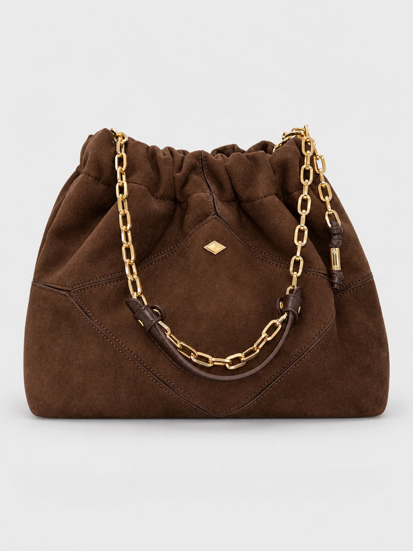 Slouchy suede-look shoulder bag with gathered top, angular stitched paneling, and chunky gold-tone chain strap, detail view