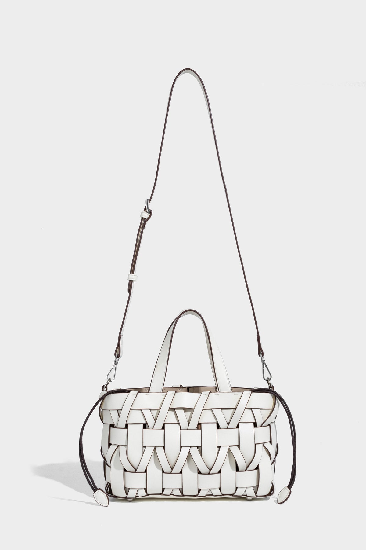 Structured woven basket tote handbag with contrasting dark trim, double top handles, detachable shoulder strap, and