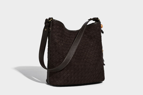 Dark chocolate woven texture hobo shoulder bag with multicolor tassel-and-bead charm and long adjustable strap, detail view