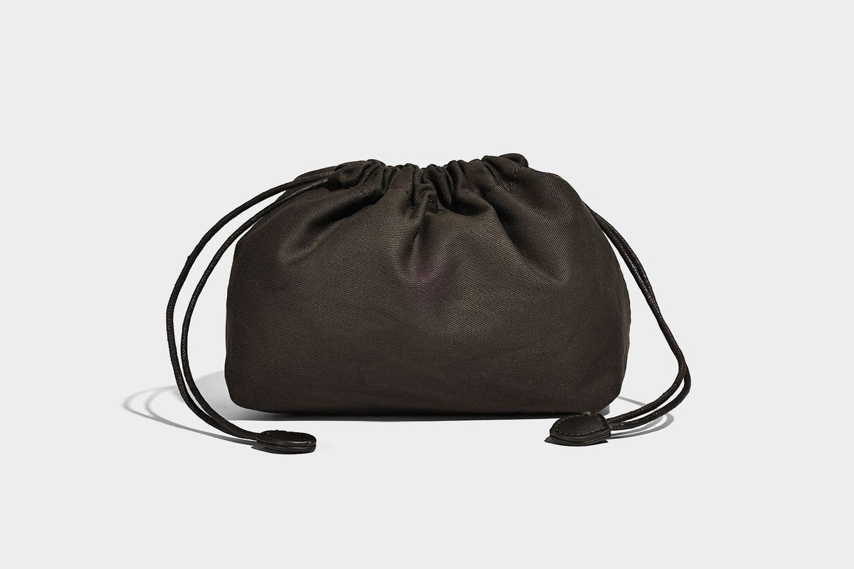 Small structured woven-panel mini tote bag with double top handles and detachable crossbody strap in matte leather-look