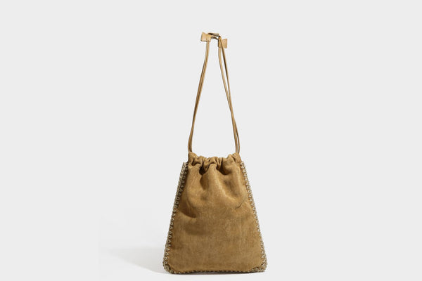 Matte suede-look drawstring bucket bag with cream braided woven edge trim and slim adjustable leather-look shoulder strap