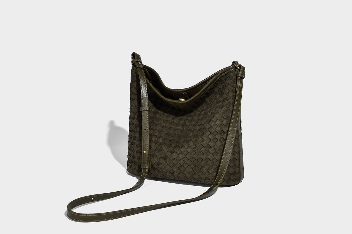 Dark chocolate woven texture hobo shoulder bag with multicolor tassel-and-bead charm and long adjustable strap, detail view