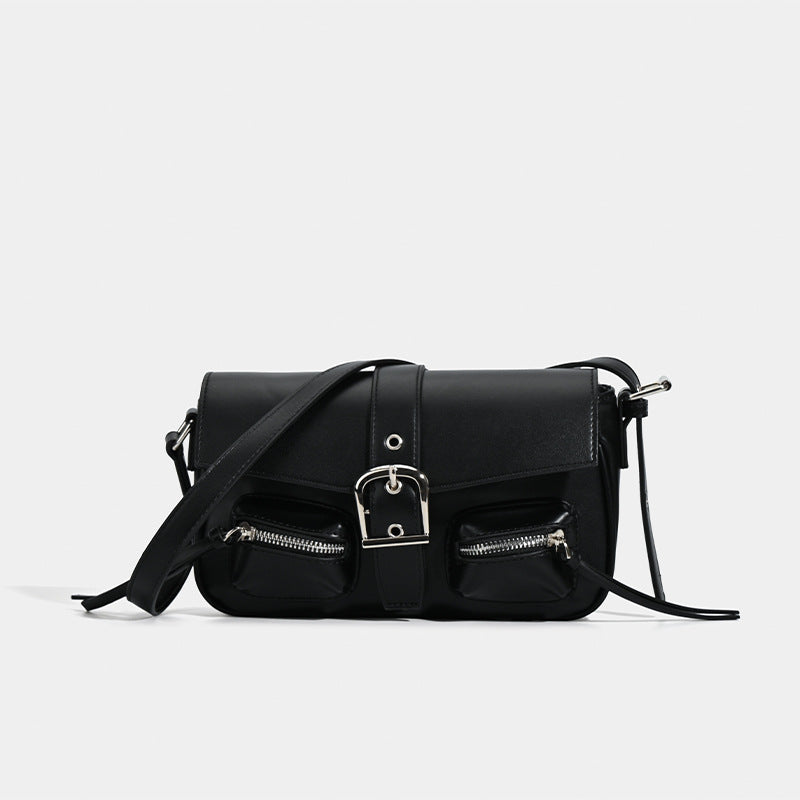 Structured flap crossbody bag with front buckle strap and dual zip pockets in smooth leather-look finish with silver-tone