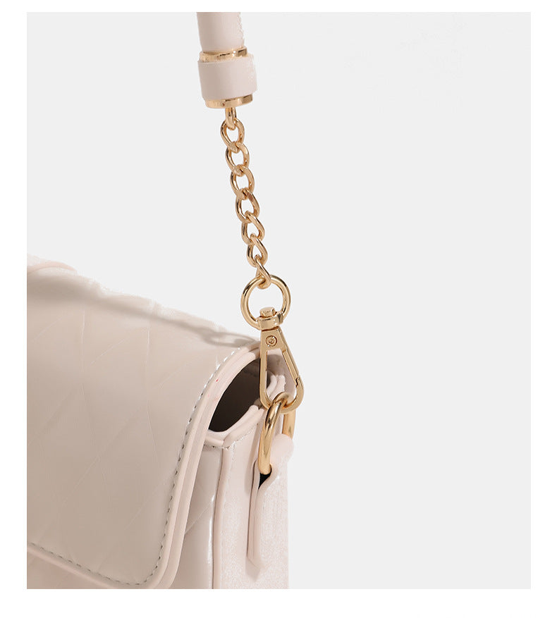 Compact rectangular quilted flap crossbody bag with gold-tone turn-lock closure and chain strap, detail view 18
