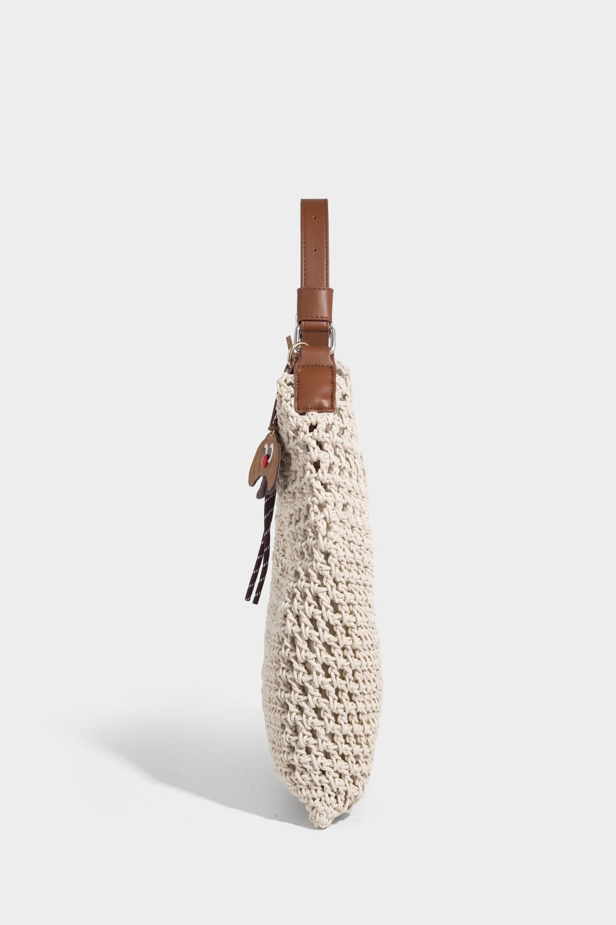 Slouchy open-knit crochet hobo tote bag with leather-look top handle and metal buckle hardware, detail view 17