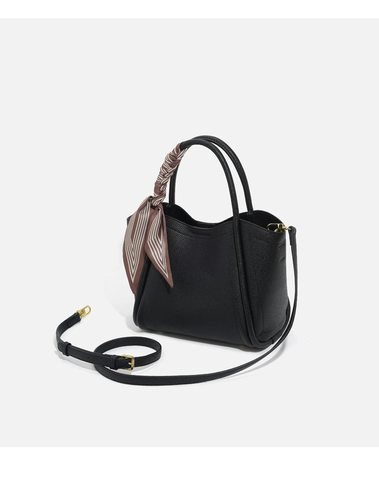 Pebbled leather-look bucket tote bag with scarf-wrapped top handle and gold-tone hardware, detail view 20