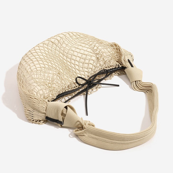 Crescent-shaped open-weave mesh shoulder bag with black drawstring cord tie and long padded strap, detail view 4