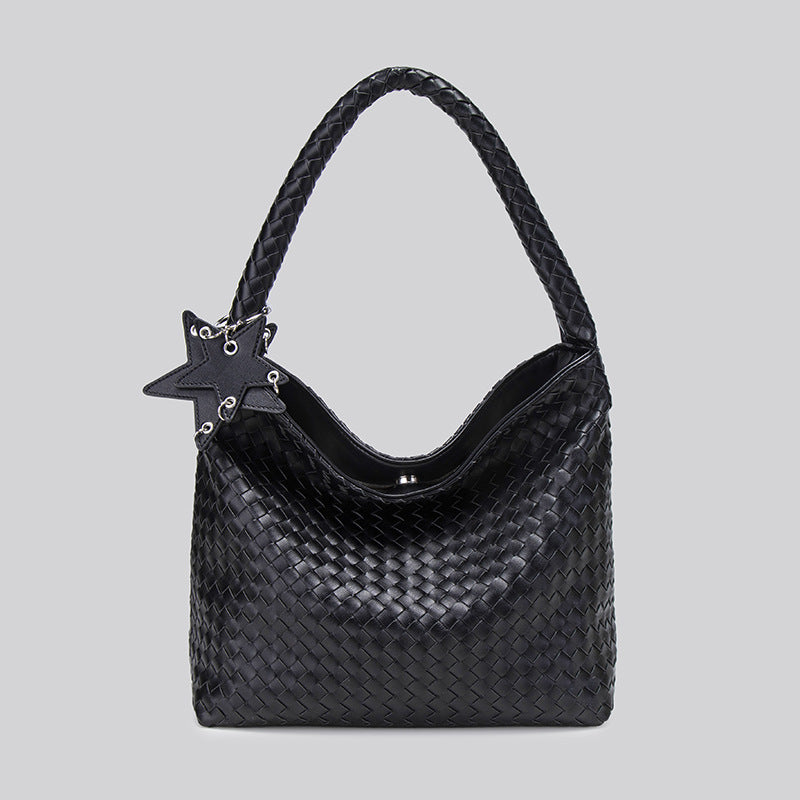 Large woven leather-look hobo shoulder bag with braided strap and star charm, detail view 7