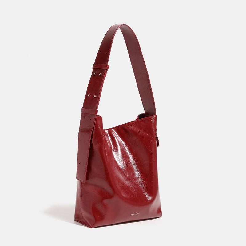 Glossy leather-look oversized shoulder tote bag with wide flat strap and soft rectangular silhouette, detail view 3