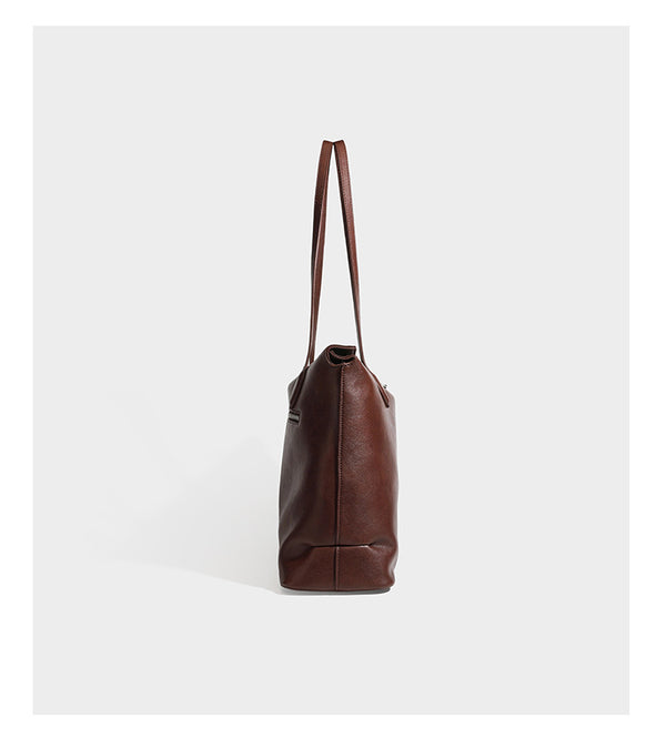 Large leather-look tote shoulder bag with slim double straps and silver-tone turn-lock closure, detail view 9