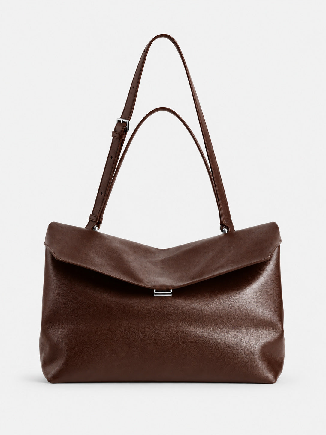 Large black slouchy leather-look shoulder bag with V-shaped envelope flap, silver-tone clasp, and adjustable strap, detail