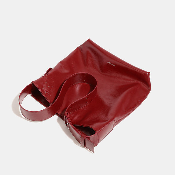 Glossy leather-look oversized shoulder tote bag with wide flat strap and soft rectangular silhouette, detail view 4