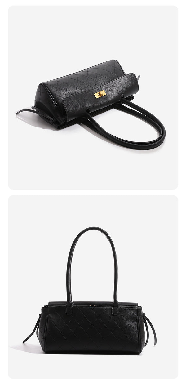 Structured black baguette bag with diamond-quilted front panel, gold-tone turn-lock flap closure, and dual looped top