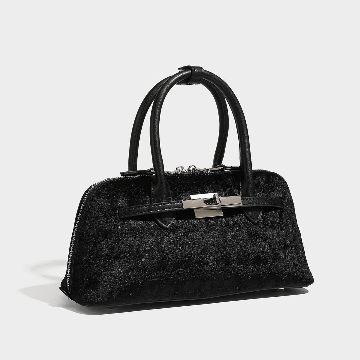 Small structured satchel bag in dark brown velvet-like textured finish with leather-look trim, silver-tone turn-lock bar