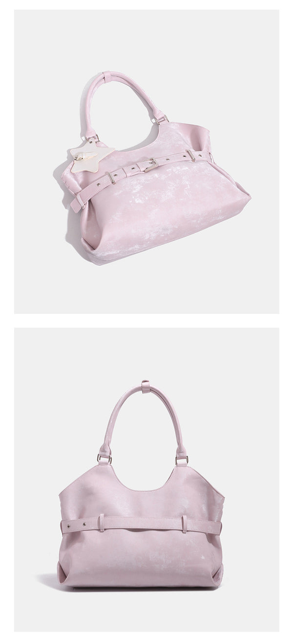 Large soft hobo shoulder bag with glossy textured finish, decorative belt buckle, star charm, and silver-tone hardware