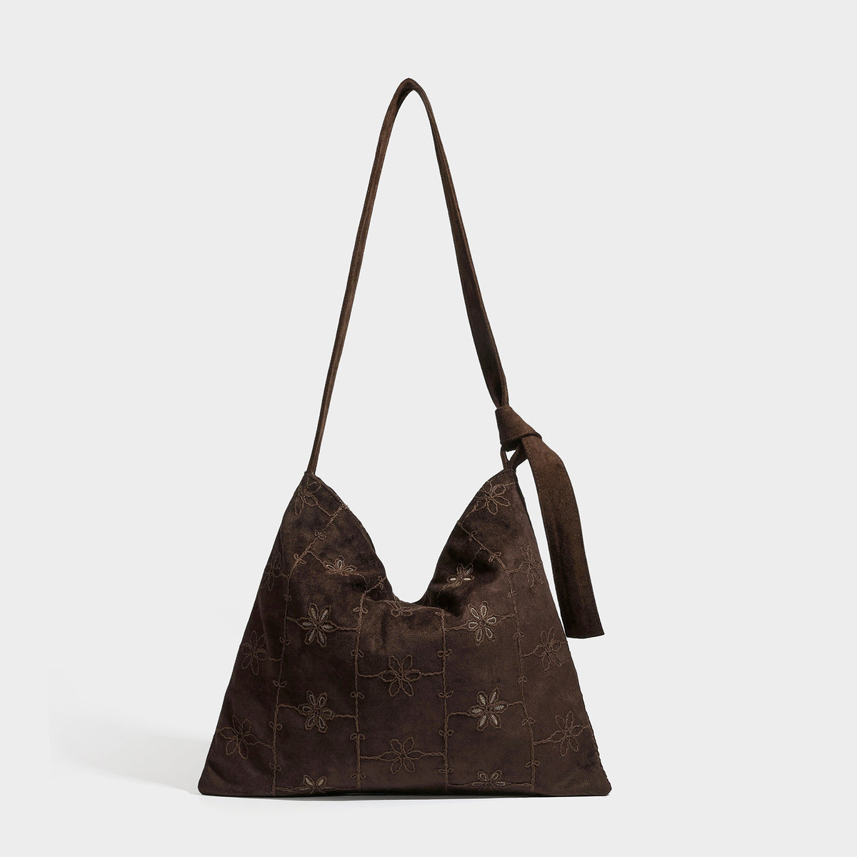 Lässig weich fallende Hobo-Schultertasche in dunkelbrauner Velourslederoptik mit Ton-in-Ton-Blumenstickerei und langem, geknotetem Einzelriemen, Detailansicht
