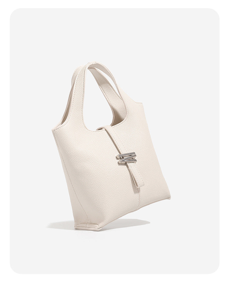 Mini pebbled leather-look bucket tote with silver toggle clasp and dual top handles, detail view 8