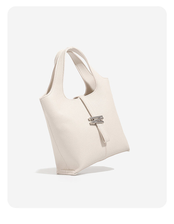 Mini pebbled leather-look bucket tote with silver toggle clasp and dual top handles, detail view 8
