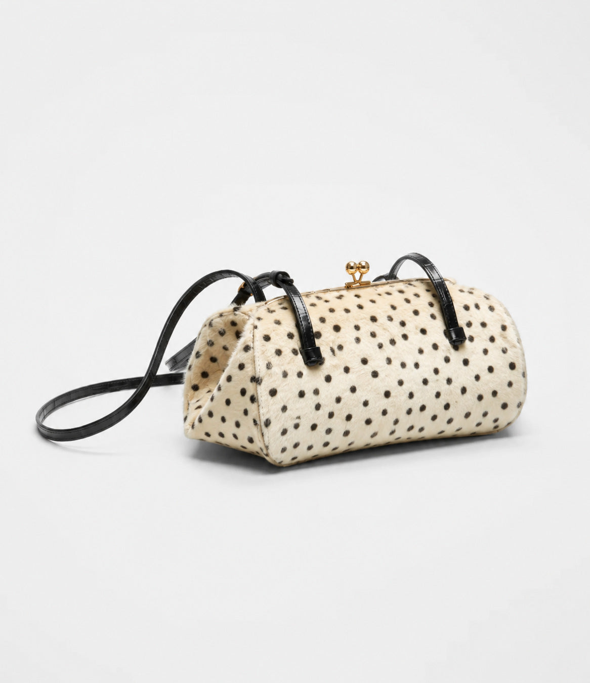 Spotted faux-fur barrel shoulder bag with gold kiss-lock clasp and black adjustable leather-look straps, detail view 14