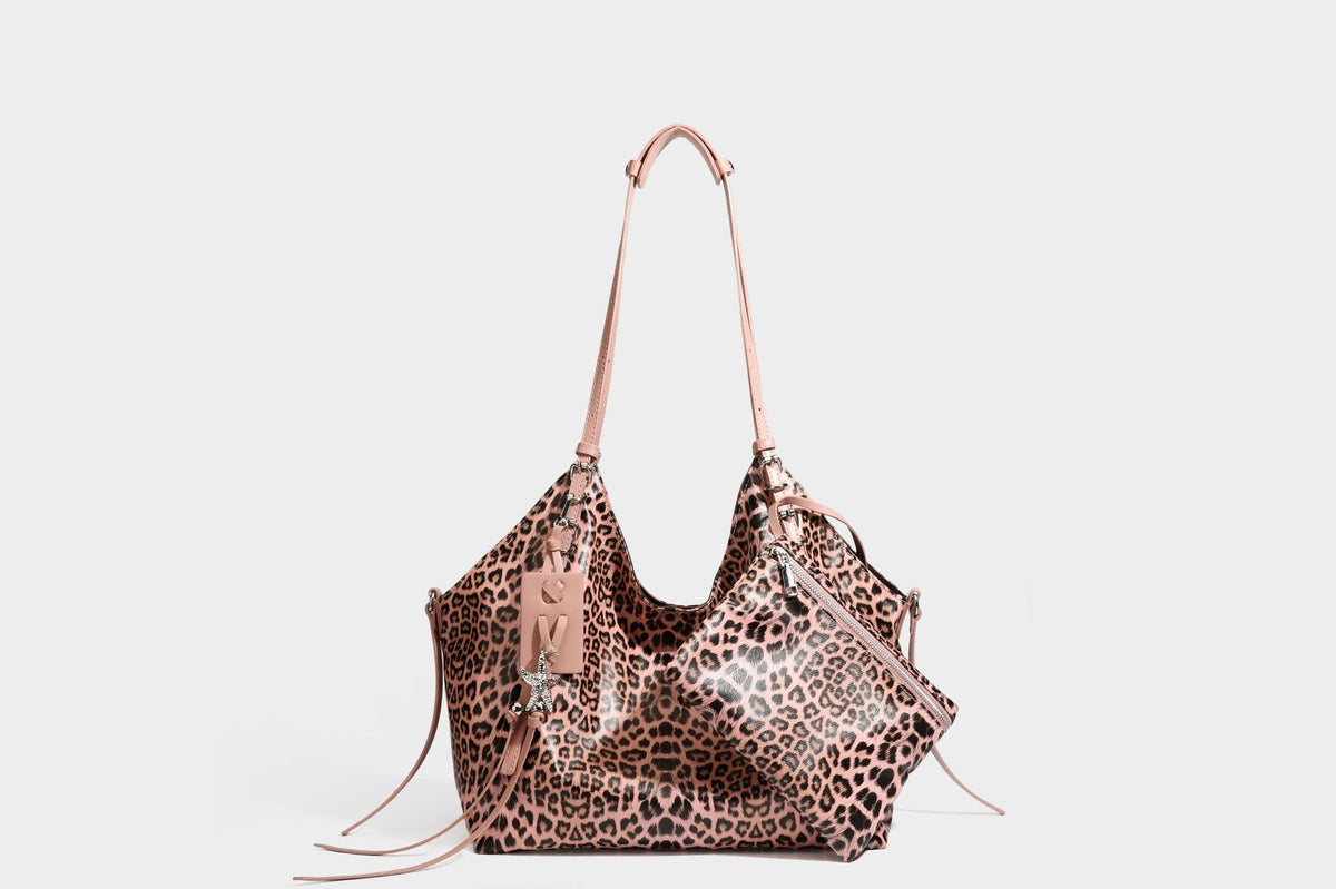Large leopard print shoulder tote bag with glossy finish, long double straps, front zip pocket, silver-tone hardware, and
