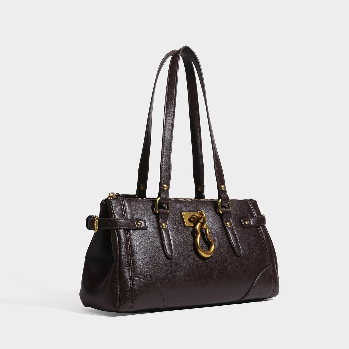 Structured dark brown leather-look satchel tote with antique gold-tone ring clasp, dual top handles, and side buckle strap