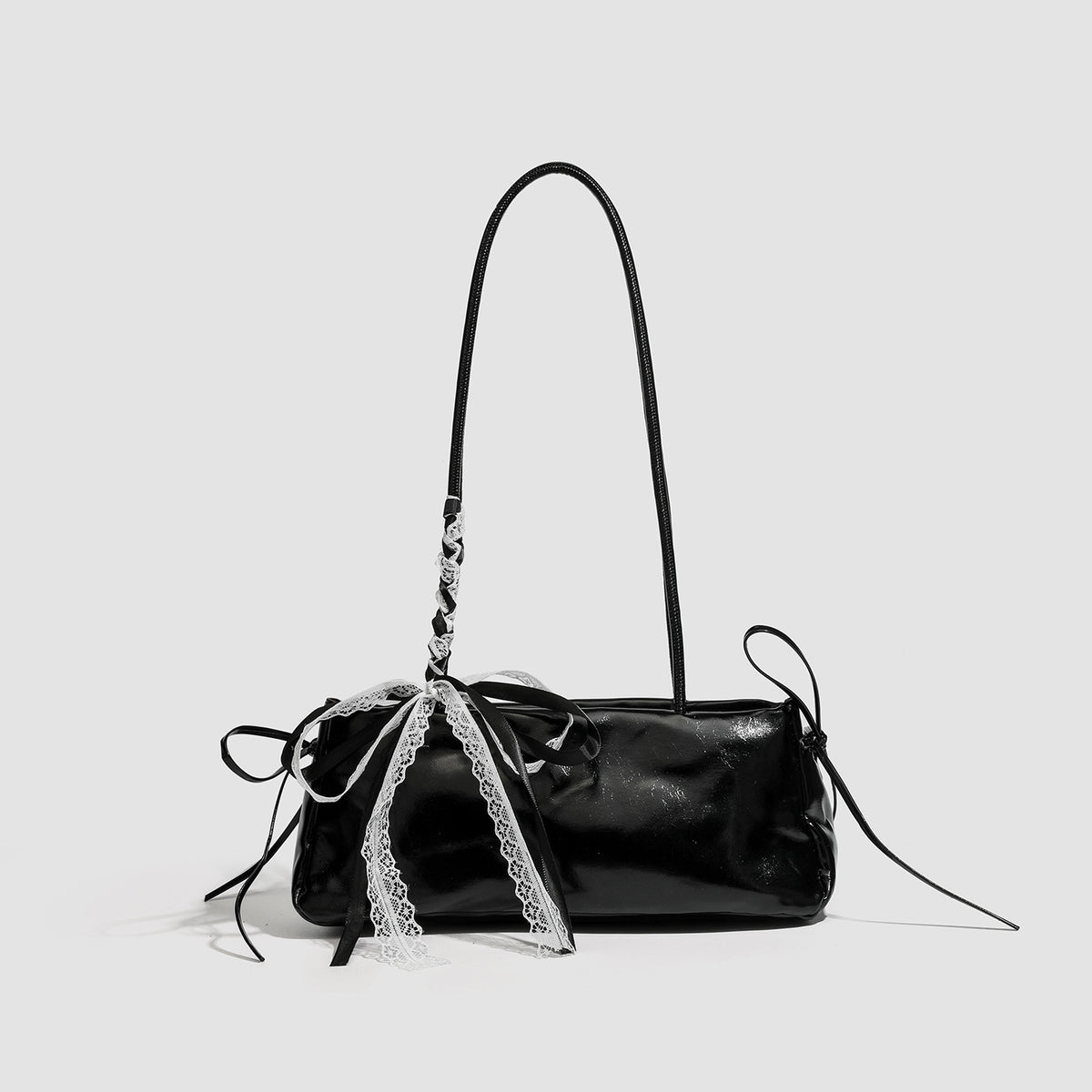 Compact glossy leather-look shoulder bag with lace bow and ribbon trim, detail view 6