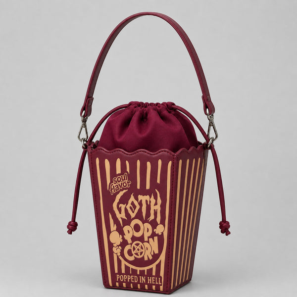 Bordeauxrote Gothic-Umhängetasche in Popcorn-Eimer-Form mit Kordelzug, goldfarbenem Grafikprint und silberfarbener Kettenriemen, Detailansicht 4