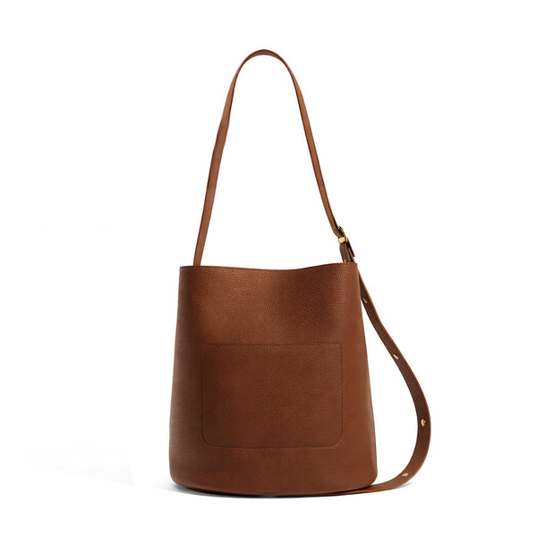 Pebbled textured bucket bag with gold-tone kiss-lock front pocket and adjustable single shoulder strap, detail view 16