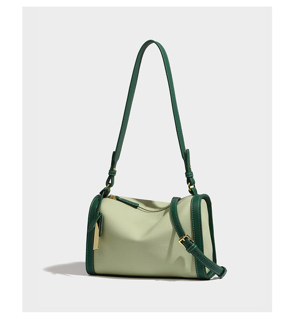 Structured two-tone shoulder bag with pebbled leather-look finish, contrast trim, top zip closure, and gold-tone hardware